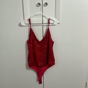 Red sequins body suit.